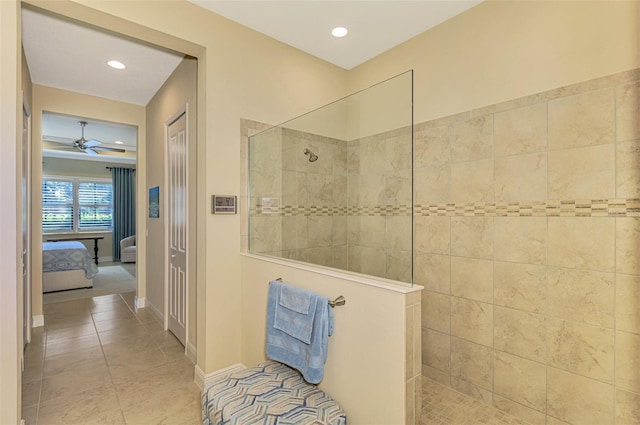 bathroom with tile patterned flooring, ceiling fan, and tiled shower