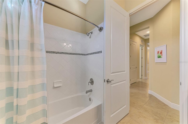 bathroom with tile patterned floors and shower / bath combination with curtain