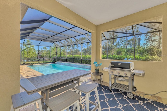 view of pool featuring a patio area, grilling area, and a lanai