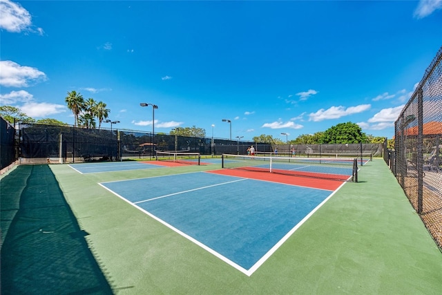 view of sport court with basketball hoop