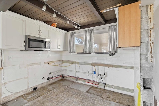 kitchen with white cabinetry and wooden ceiling