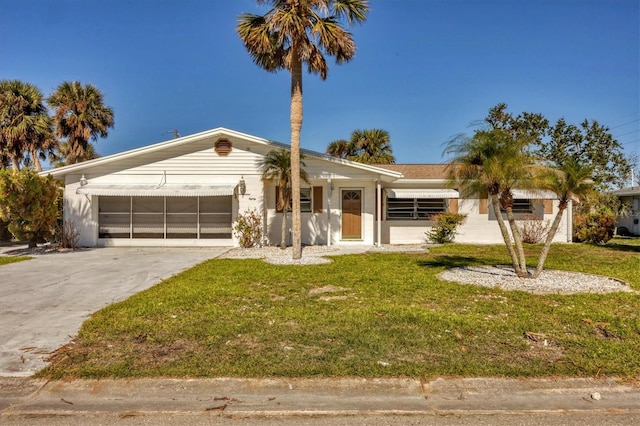 single story home with a front yard and a garage