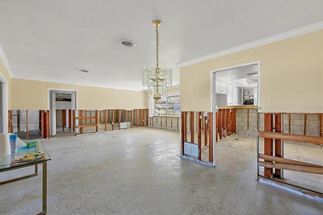 interior space with ornamental molding and a chandelier