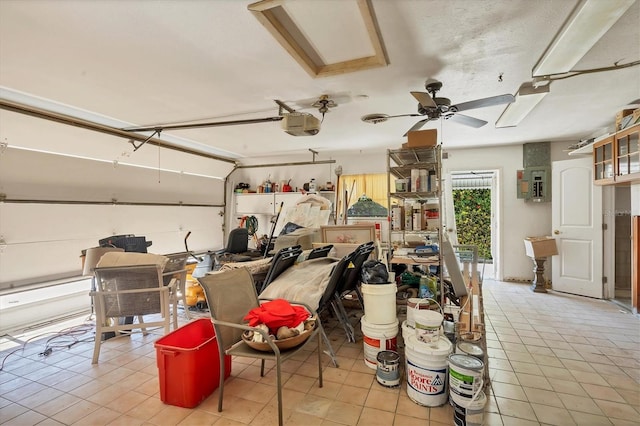 garage featuring a garage door opener and ceiling fan