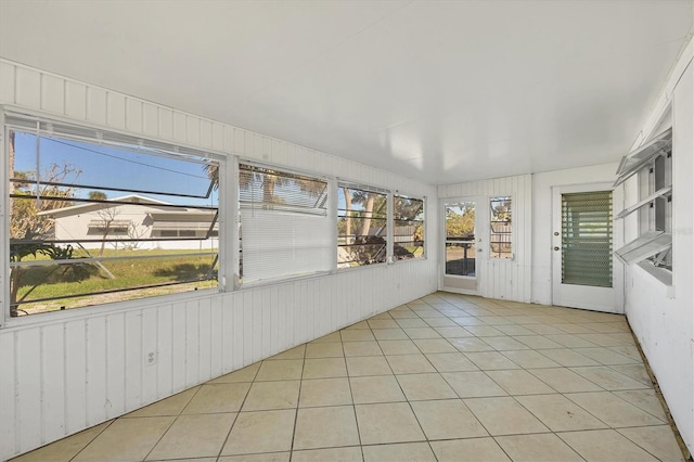 unfurnished sunroom featuring a wealth of natural light