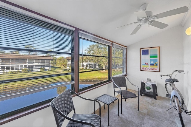 sunroom featuring ceiling fan and vaulted ceiling