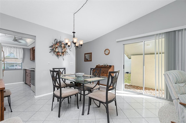 dining space featuring light tile patterned floors, vaulted ceiling, and a notable chandelier