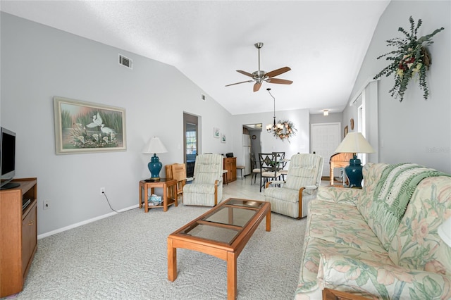 living room featuring light carpet, ceiling fan with notable chandelier, and lofted ceiling