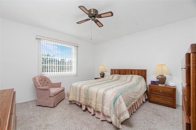 bedroom with light carpet and ceiling fan