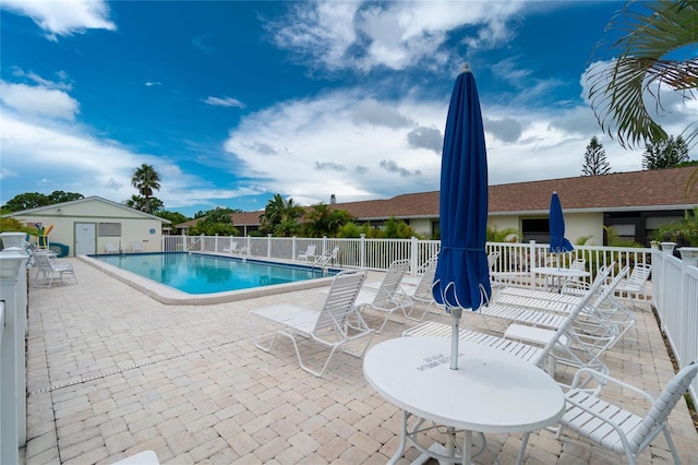 view of swimming pool featuring a patio