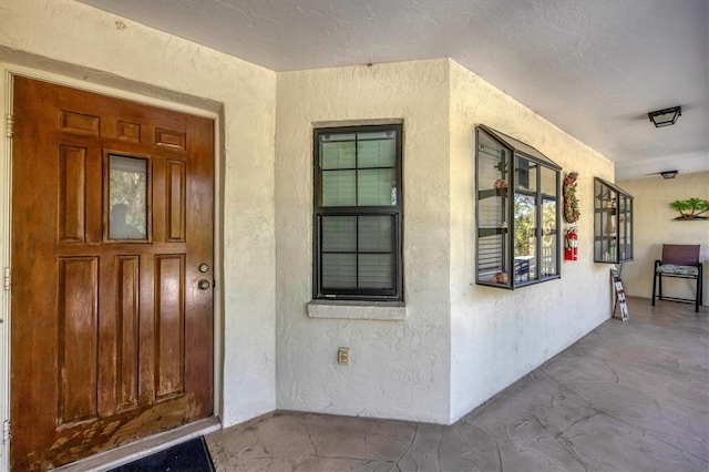 property entrance featuring covered porch