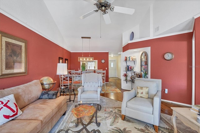 living room with ceiling fan, hardwood / wood-style floors, and lofted ceiling