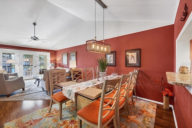 dining area featuring ceiling fan, french doors, dark hardwood / wood-style flooring, crown molding, and lofted ceiling