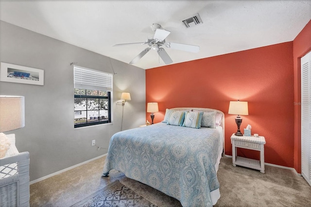 carpeted bedroom featuring ceiling fan