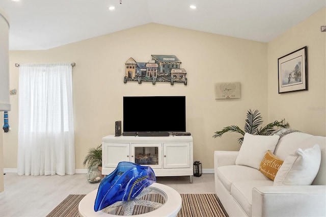 living room featuring light colored carpet and vaulted ceiling