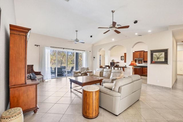 living room featuring light tile patterned floors, ceiling fan, and lofted ceiling