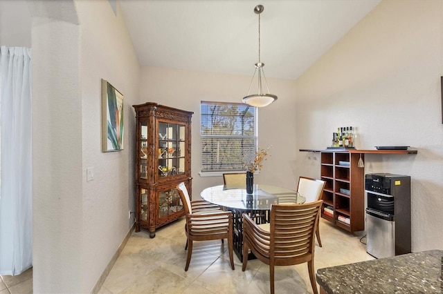 dining space with vaulted ceiling