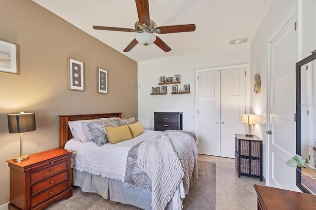 tiled bedroom with a closet and ceiling fan