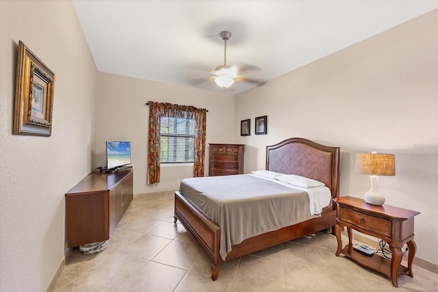 tiled bedroom with ceiling fan