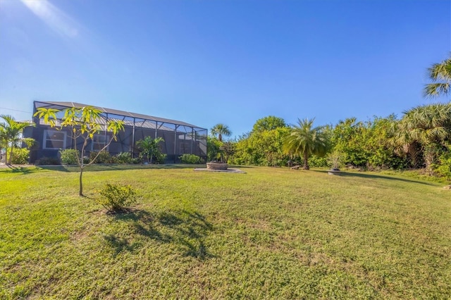 view of yard featuring a lanai