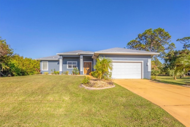 view of front of house featuring a front yard and a garage