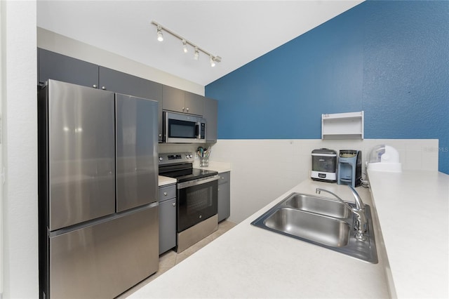 kitchen featuring stainless steel appliances and sink