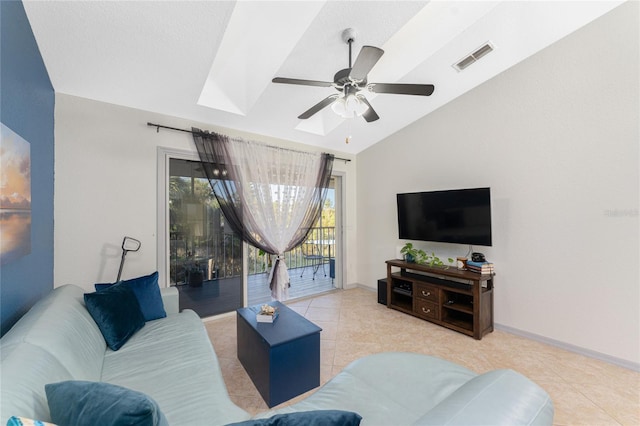 living room featuring light tile patterned floors, ceiling fan, and lofted ceiling