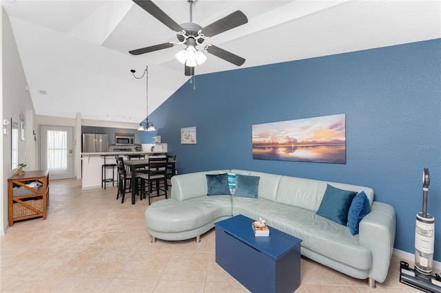 tiled living room featuring ceiling fan and high vaulted ceiling