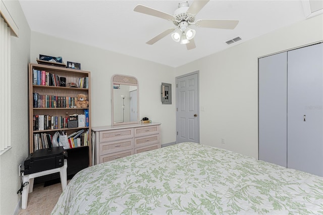 tiled bedroom featuring a closet and ceiling fan