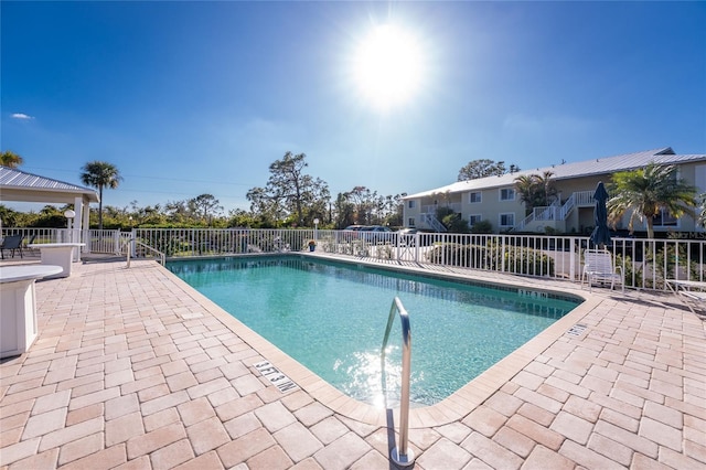 view of swimming pool featuring a patio area