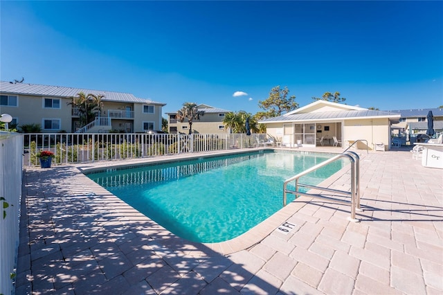 view of swimming pool with a patio area