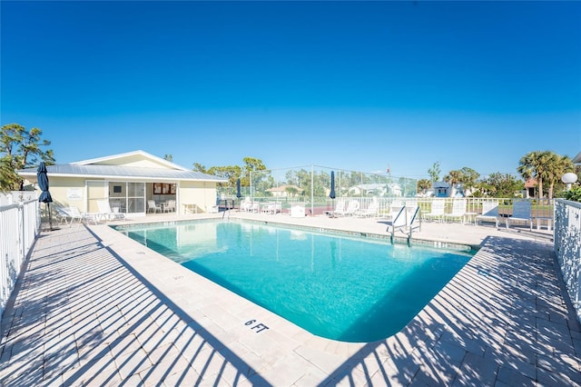 view of swimming pool featuring a patio area