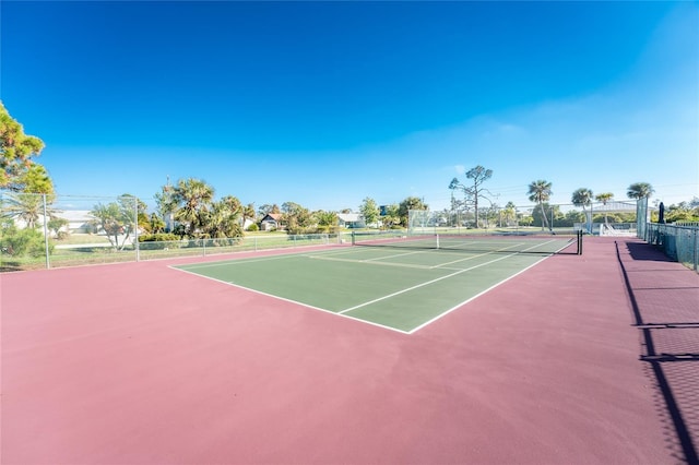 view of tennis court featuring basketball court