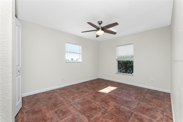 spare room with ceiling fan