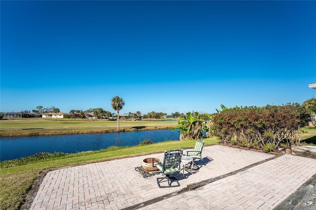 view of patio with a water view