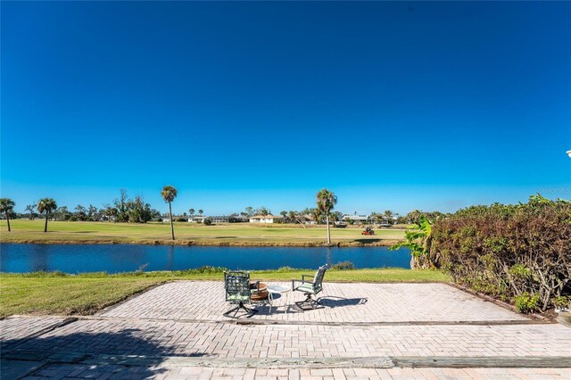 view of patio with a water view