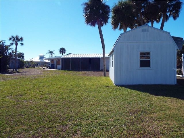 view of yard featuring a sunroom