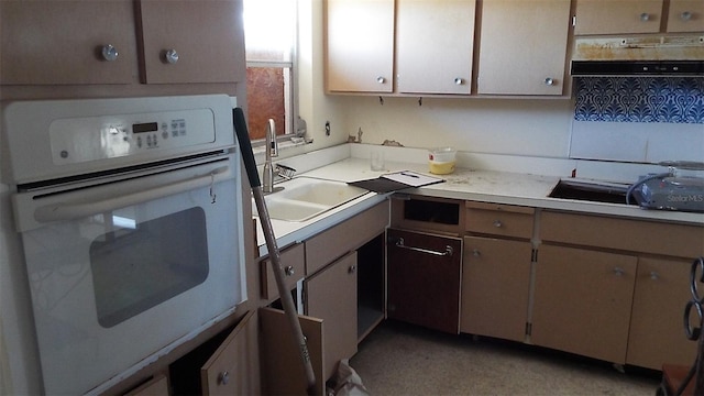 kitchen featuring sink and white oven