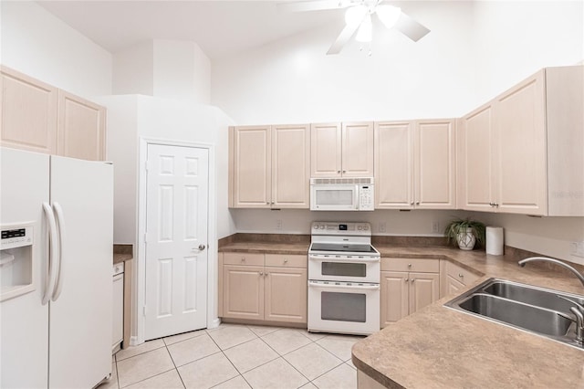 kitchen with ceiling fan, sink, high vaulted ceiling, white appliances, and light tile patterned flooring