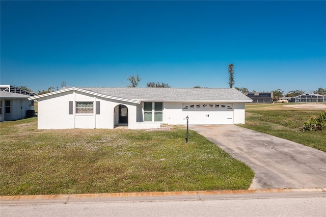 ranch-style house featuring a front yard and a garage