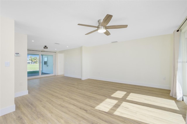 unfurnished room featuring ceiling fan and light hardwood / wood-style flooring