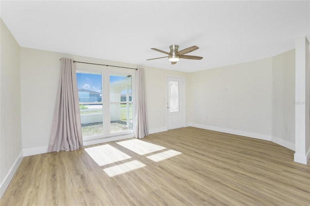 empty room with ceiling fan and light wood-type flooring