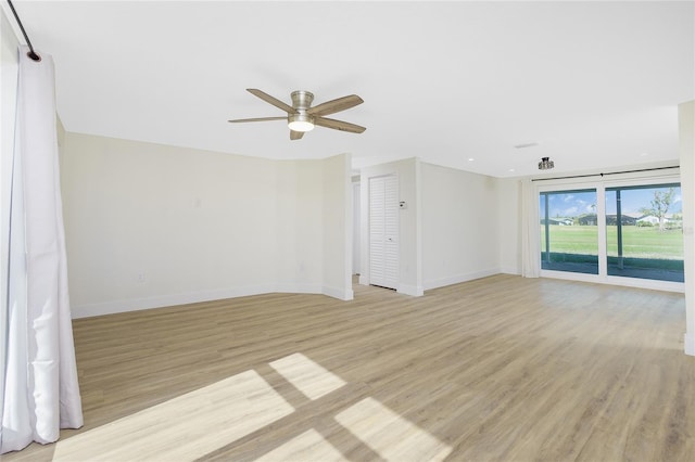 empty room featuring ceiling fan and light wood-type flooring