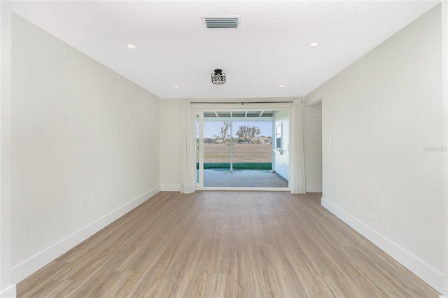 unfurnished room featuring light hardwood / wood-style flooring