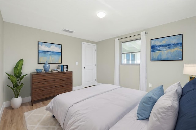 bedroom with light wood-type flooring