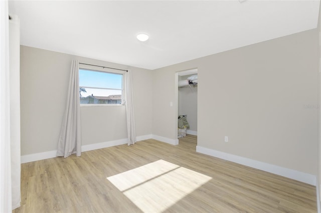 unfurnished room featuring light wood-type flooring