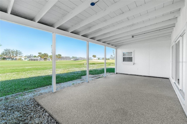 unfurnished sunroom featuring lofted ceiling with beams and wood ceiling