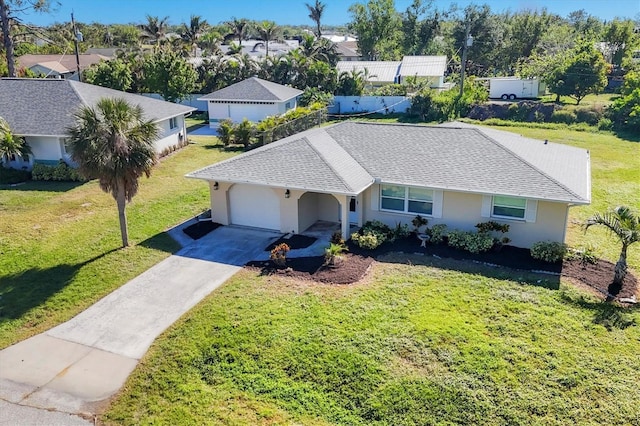 single story home featuring a front yard and a garage