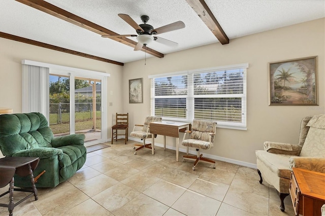 sitting room featuring beam ceiling, a textured ceiling, light tile patterned floors, and ceiling fan