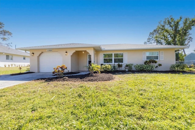 single story home with a garage and a front lawn